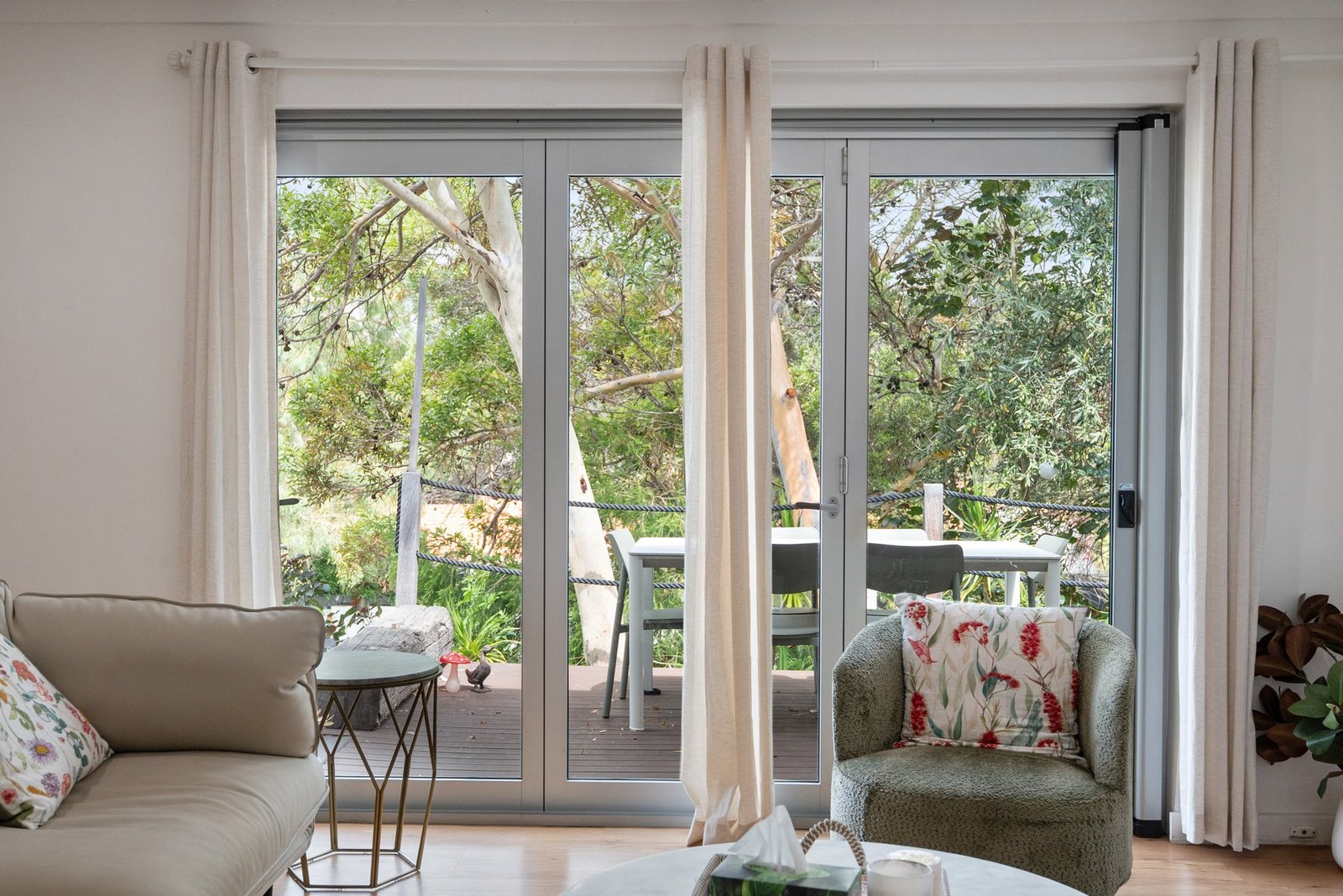 Relaxed interior opening onto a green garden