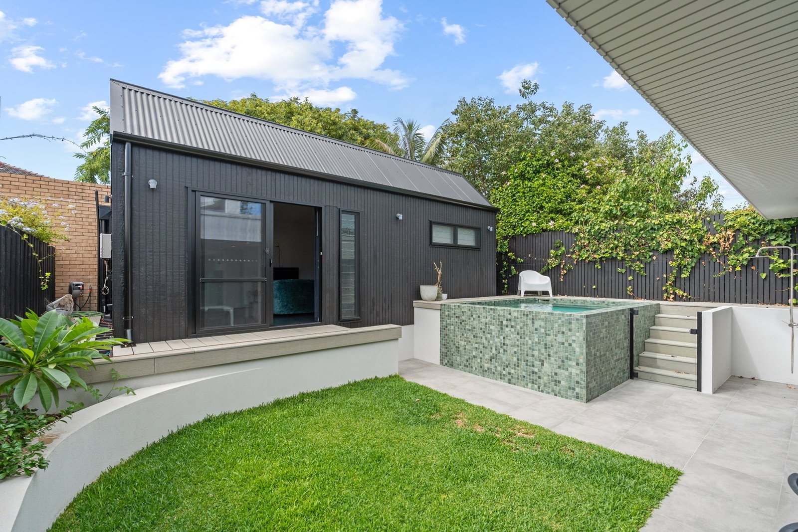 Architectural home with landscaped courtyard